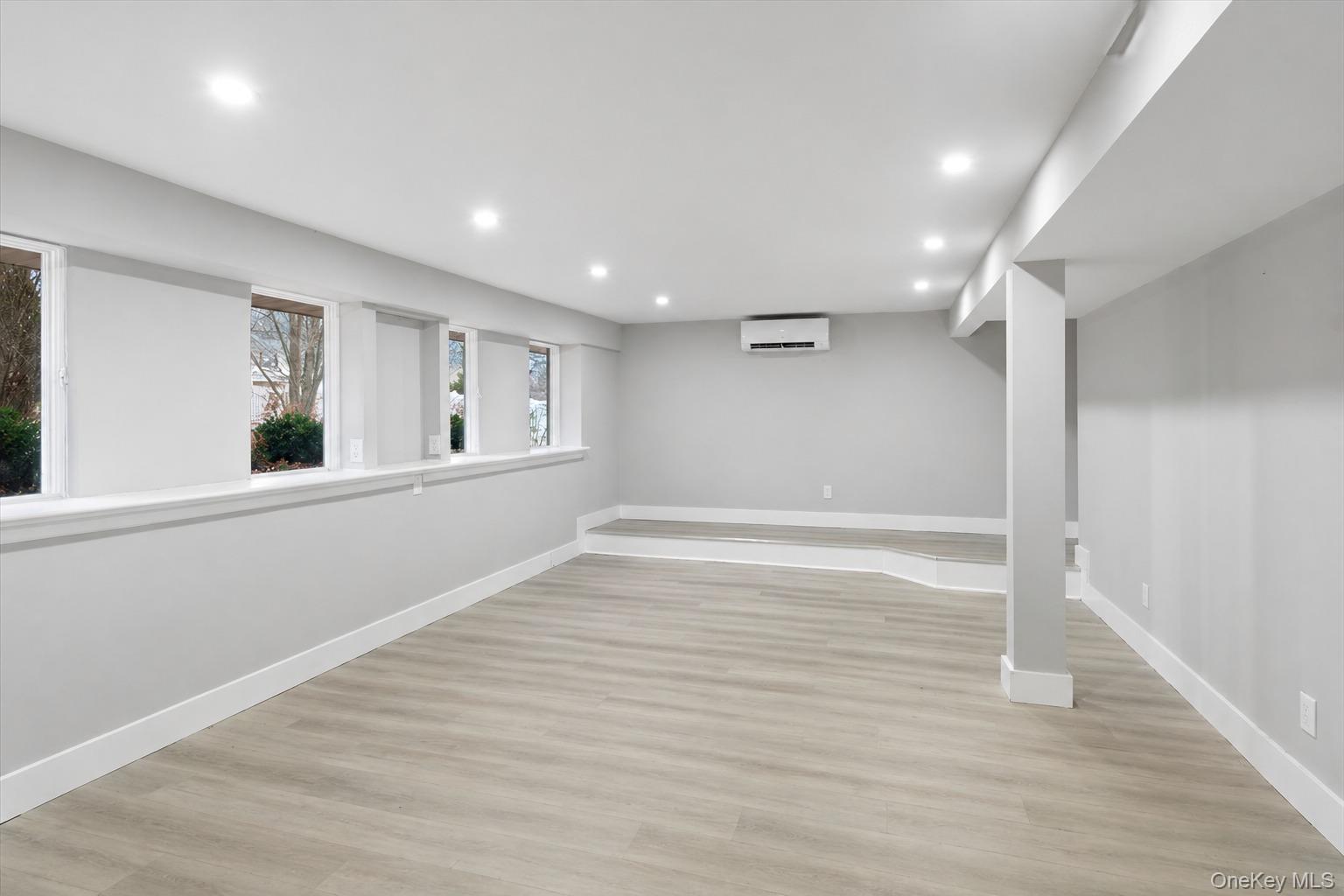 96 Fairmont Road Mahopac, NY 10541 - Photo 23 of 34 Spacious room featuring light wood-finish flooring, recessed lighting, and multiple windows