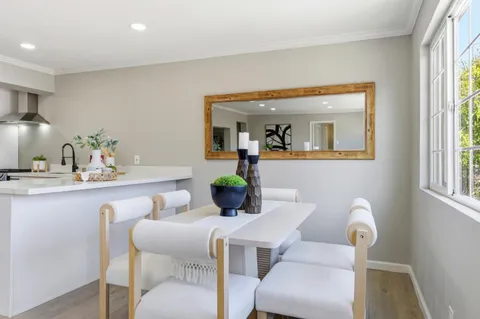 a view of a livingroom with furniture and wooden floor