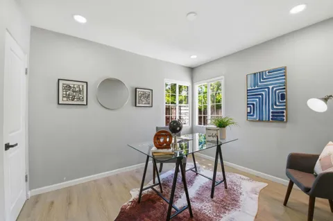 a living room with furniture and decor