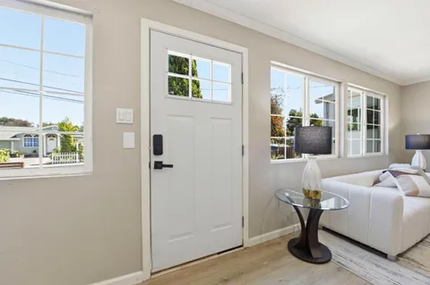 a living room with furniture and windows