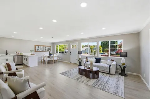 a living room with furniture and a table