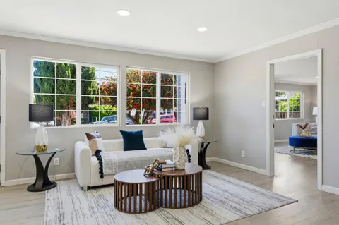 a living room with furniture and window