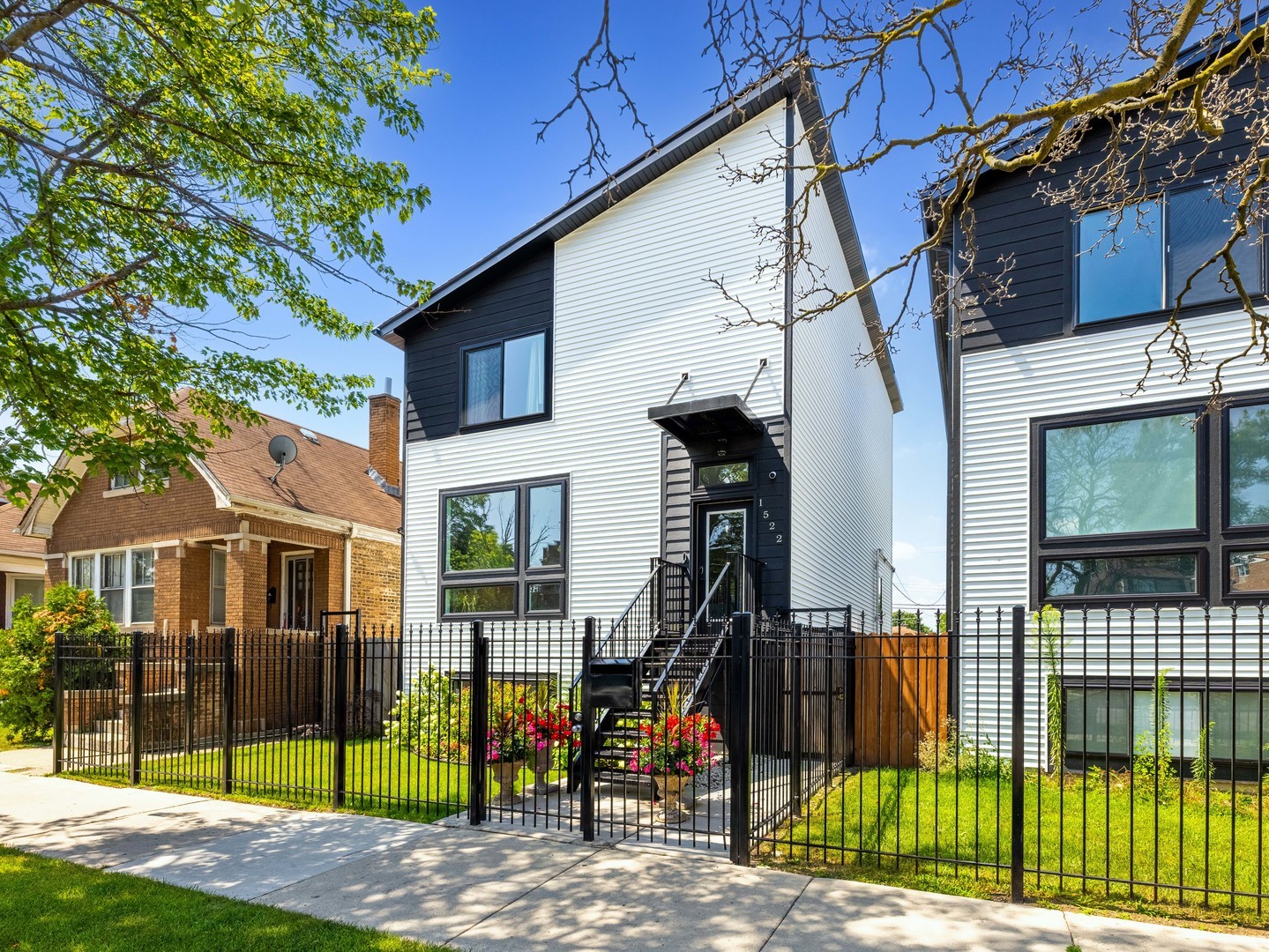 1522 North Leamington Avenue Chicago, IL 60651 - Photo 1 of 37 a view of a brick house with large windows