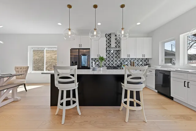 a kitchen with a sink cabinets and window