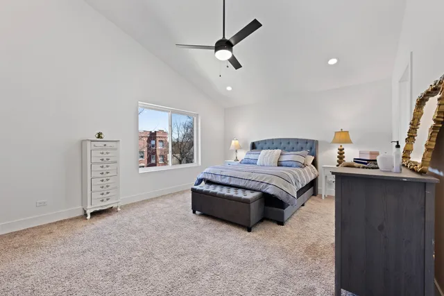 a spacious bedroom with a bed and window