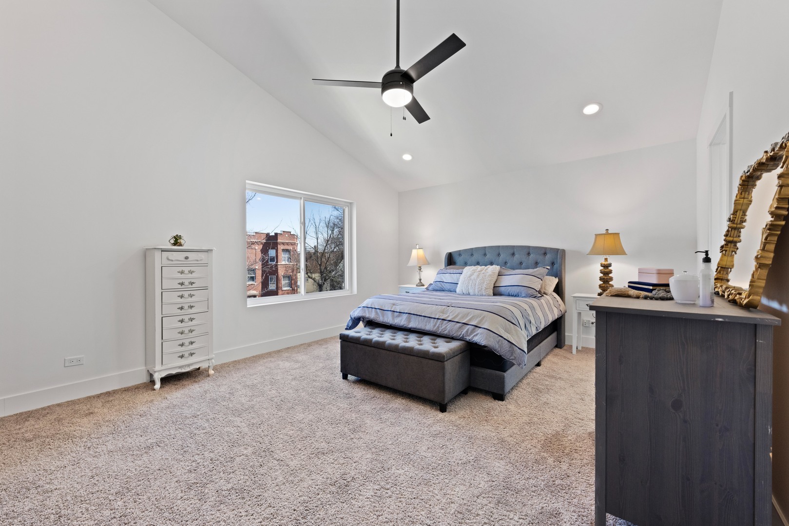 1522 North Leamington Avenue Chicago, IL 60651 - Photo 17 of 37 a spacious bedroom with a bed dresser and a window