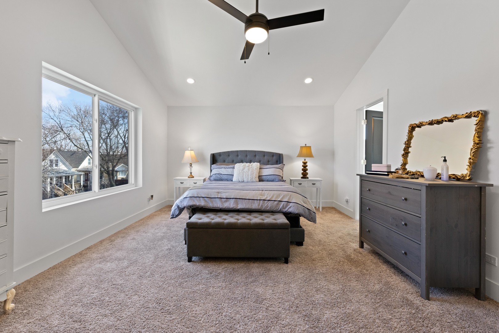 1522 North Leamington Avenue Chicago, IL 60651 - Photo 18 of 37 a spacious bedroom with a bed and window