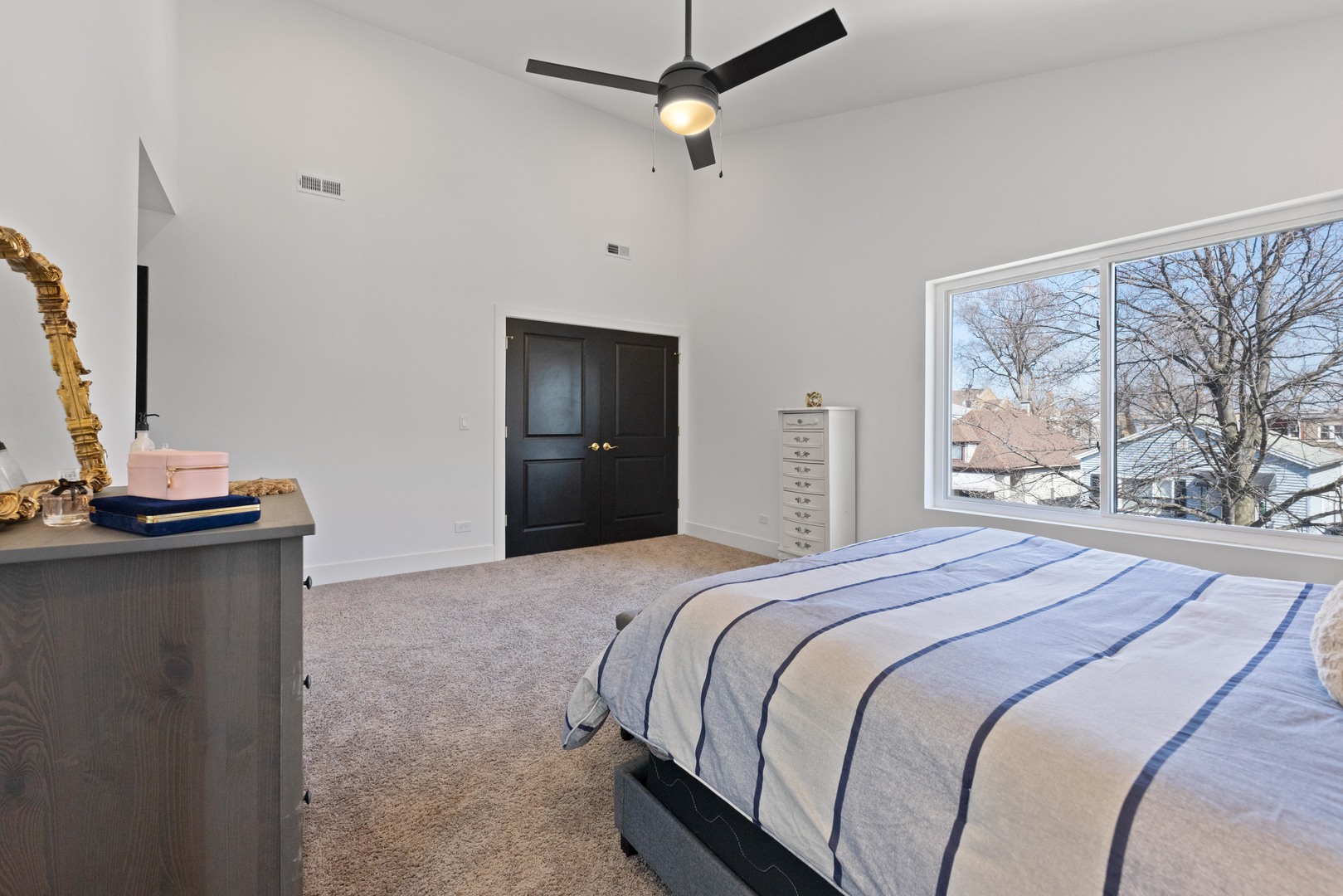 1522 North Leamington Avenue Chicago, IL 60651 - Photo 20 of 37 a bedroom with a large bed and a dresser