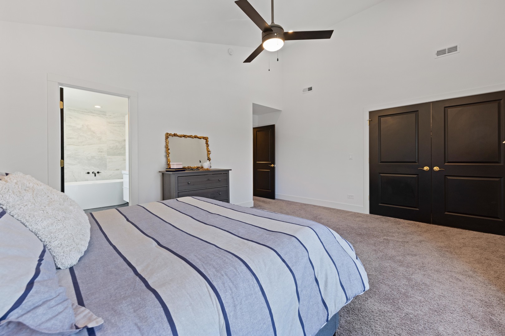 1522 North Leamington Avenue Chicago, IL 60651 - Photo 21 of 37 a bedroom with a bed and a mirror