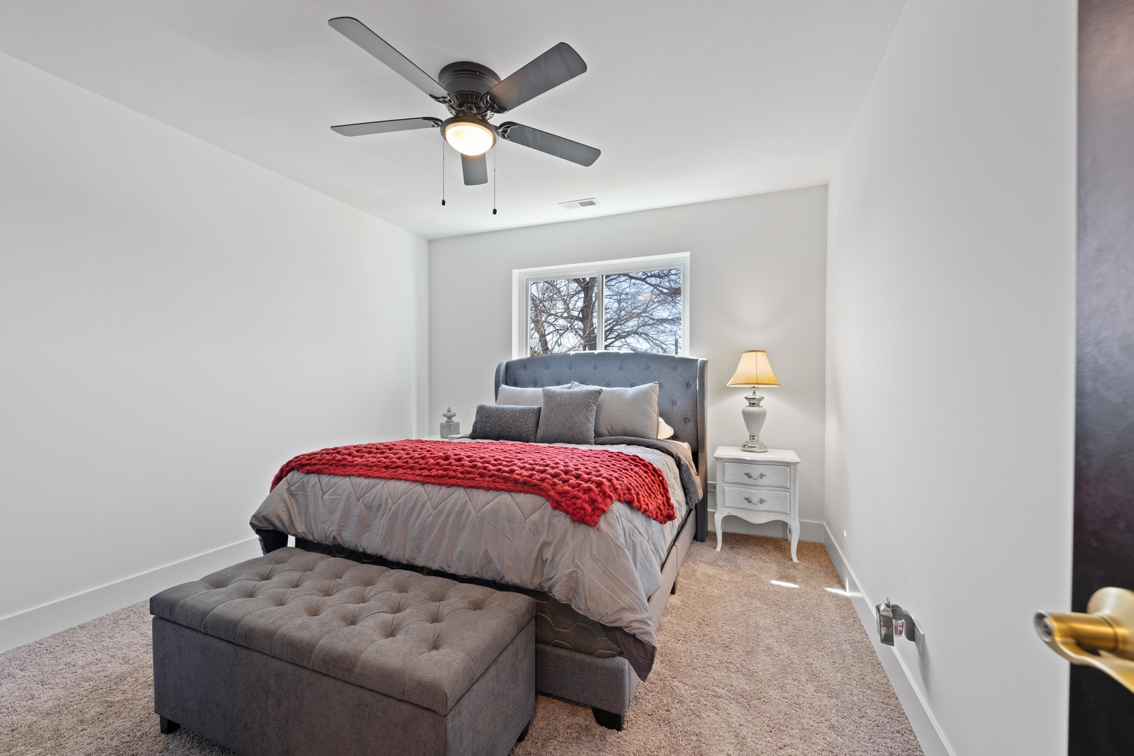 1522 North Leamington Avenue Chicago, IL 60651 - Photo 24 of 37 a bedroom with a bed and a chandelier