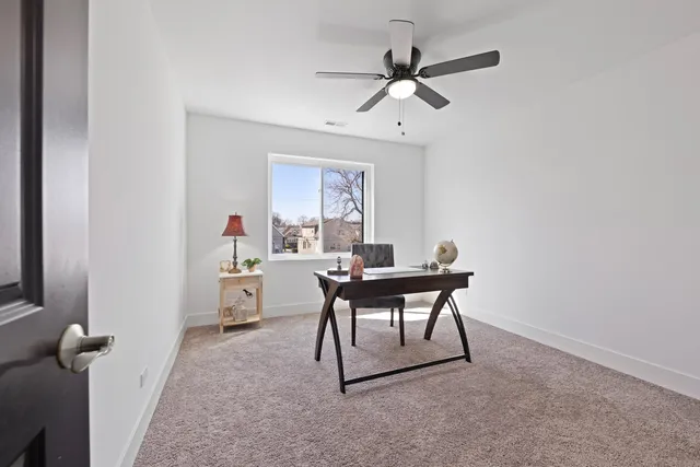 a workspace with furniture and window