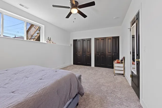 a bathroom with a sink toilet a mirror and shower
