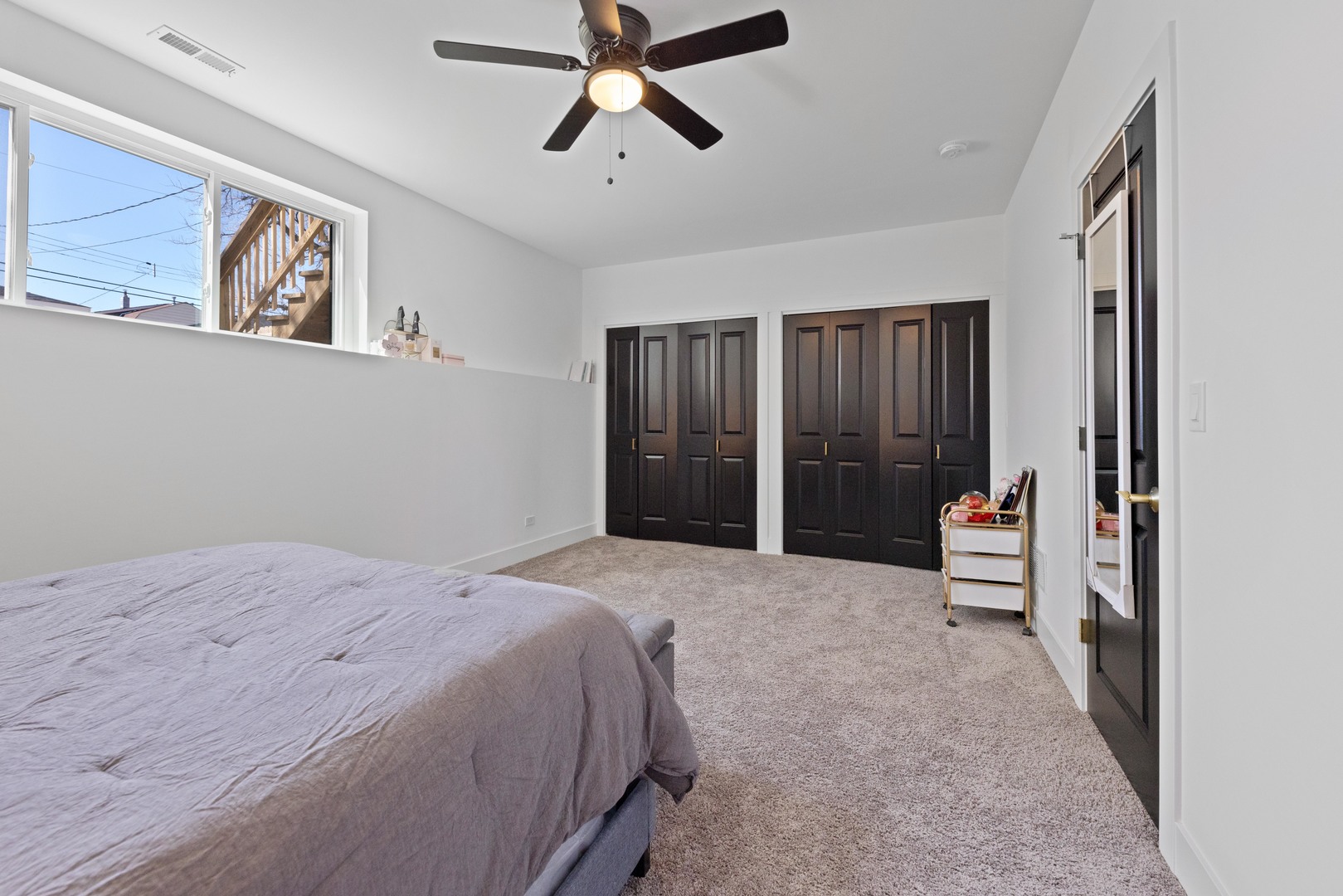 1522 North Leamington Avenue Chicago, IL 60651 - Photo 34 of 37 a spacious bedroom with a large bed and a window