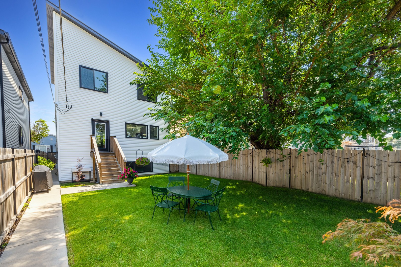 1522 North Leamington Avenue Chicago, IL 60651 - Photo 37 of 37 a view of a house with backyard and sitting area