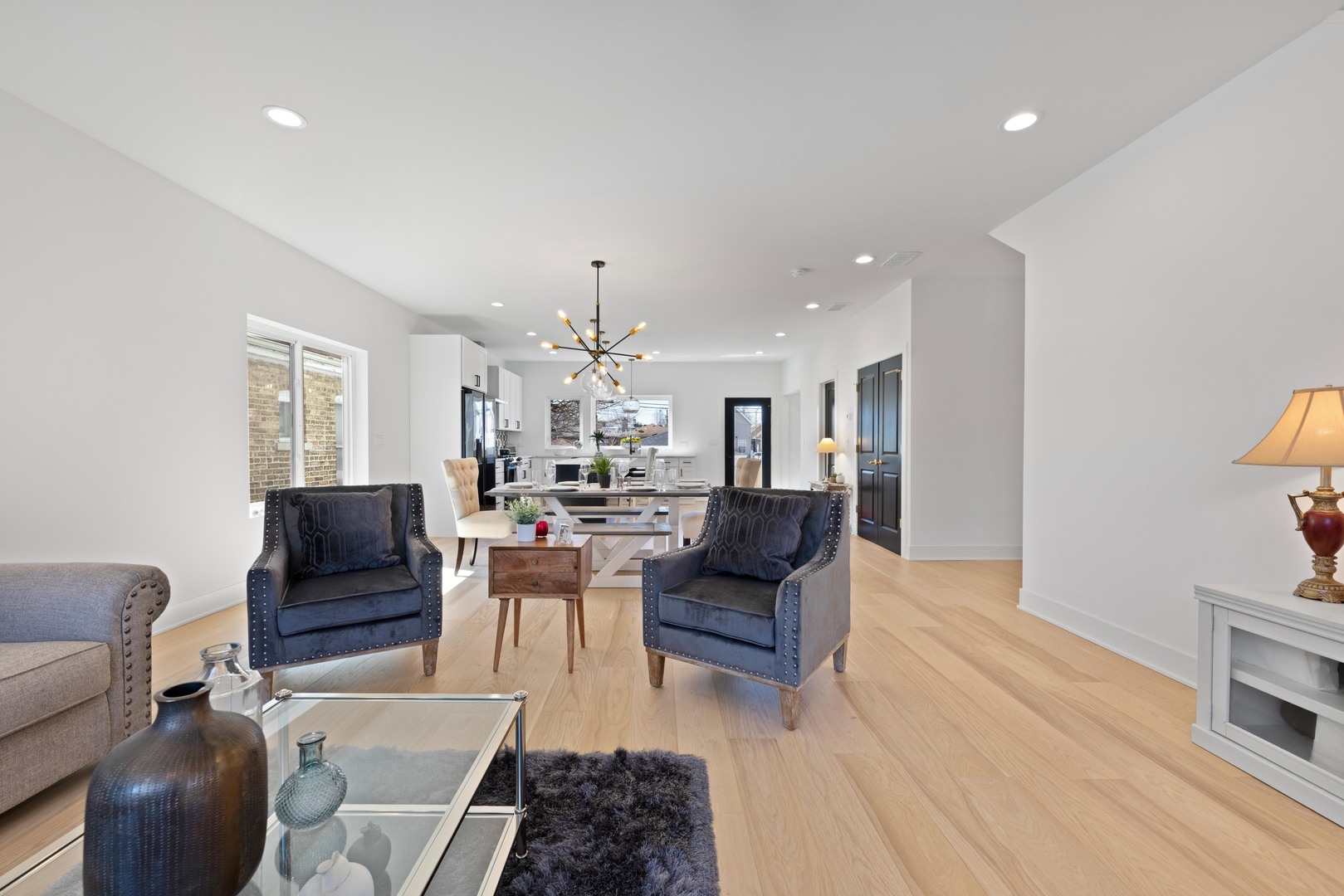 1522 North Leamington Avenue Chicago, IL 60651 - Photo 7 of 37 a living room with furniture and a chandelier