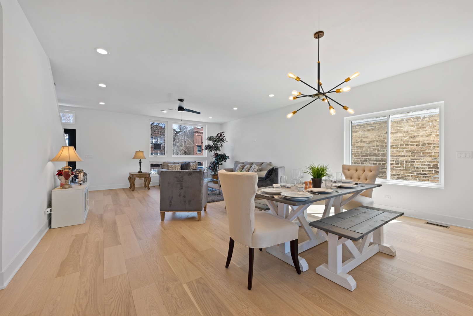1522 North Leamington Avenue Chicago, IL 60651 - Photo 8 of 37 a living room with dining room and wooden floor