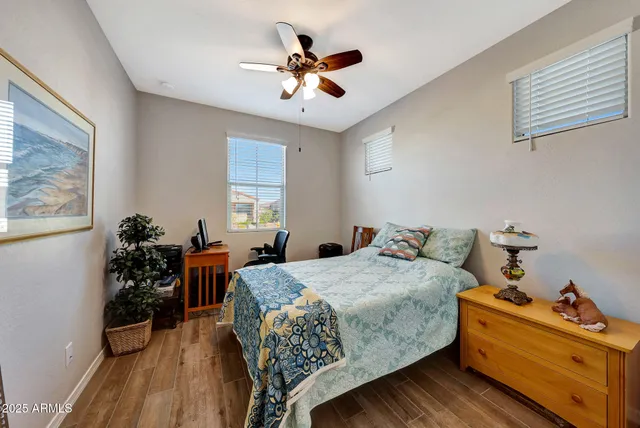 a view of a house with a yard and potted plants