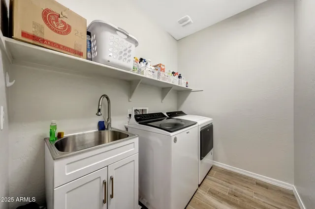 a utility room with dryer and washer