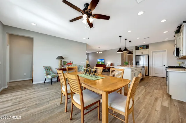 a view of a dining room with furniture and wooden floor