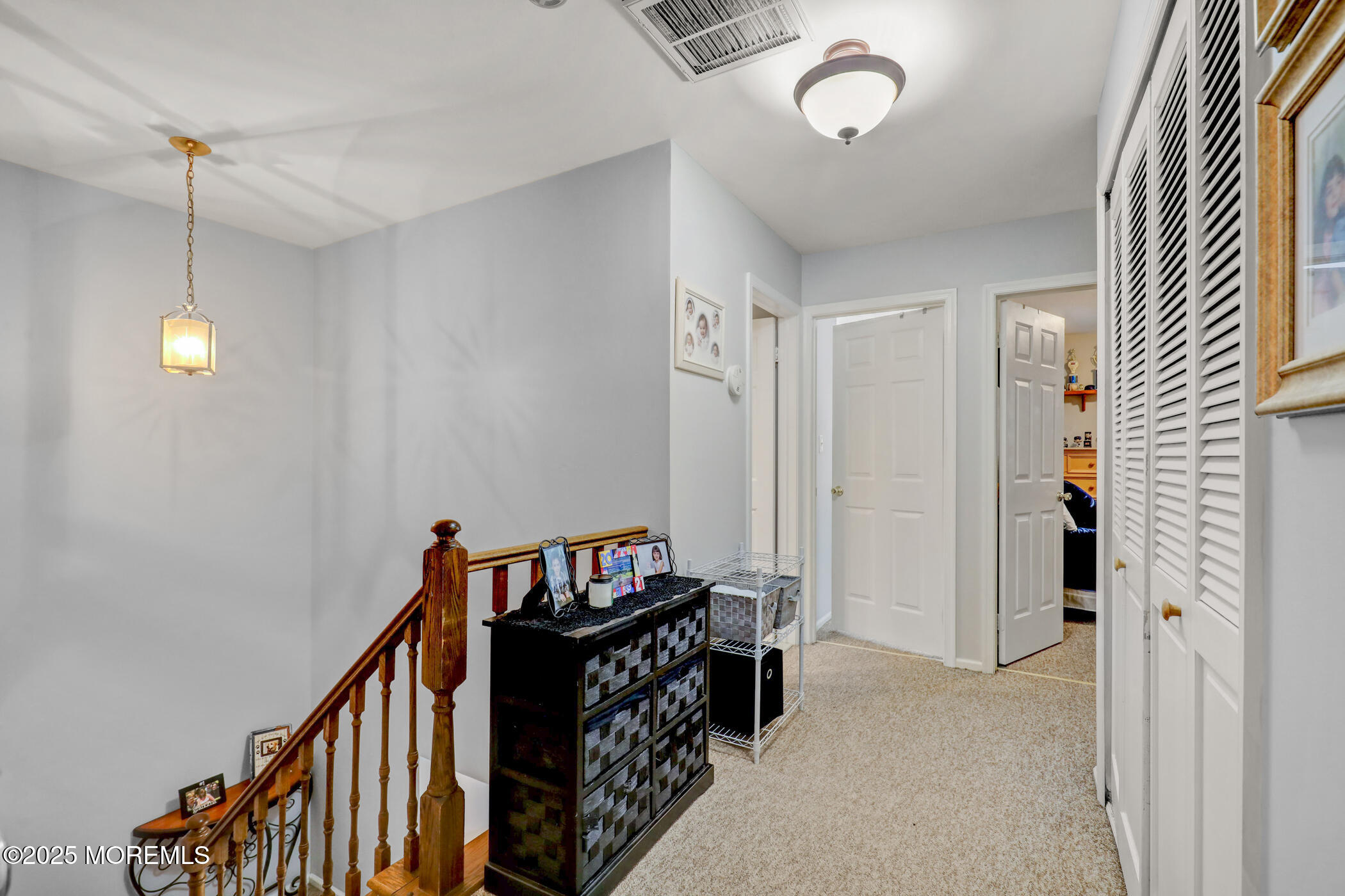 434 Hampton Court, Unit 125 Manalapan, NJ 07726 - Photo 4 of 13 a view of a hallway with workspace