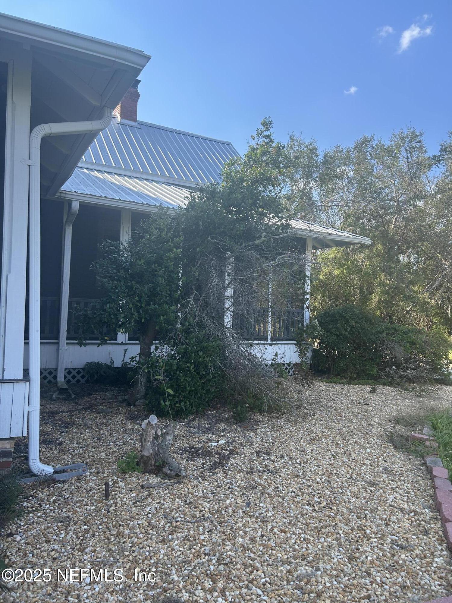 9897 Adams Road Wellborn, FL 32094 - Photo 2 of 12 a view of a house with a yard