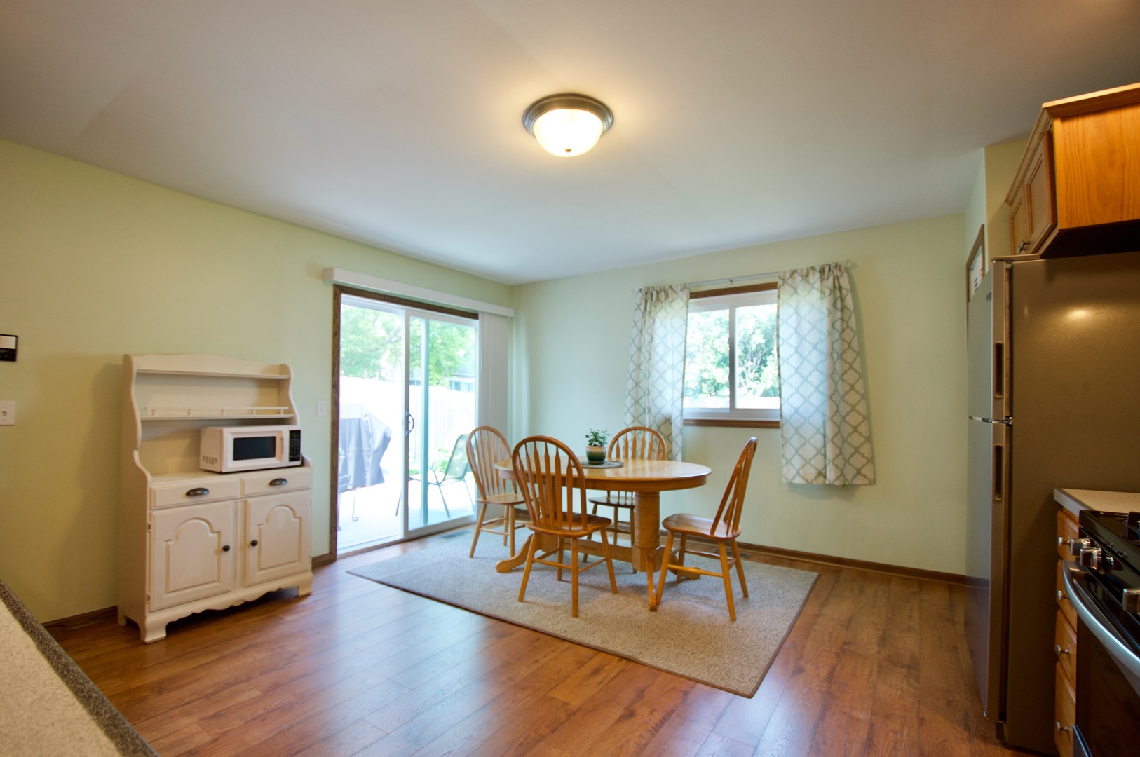 150 Heathgate Road Montgomery, IL 60538 - Photo 7 of 25 a view of a dining room with furniture and wooden floor