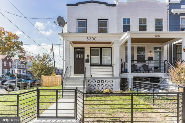 a view of a white building with many windows