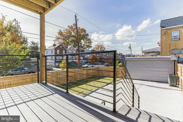 a view of a balcony with wooden floor