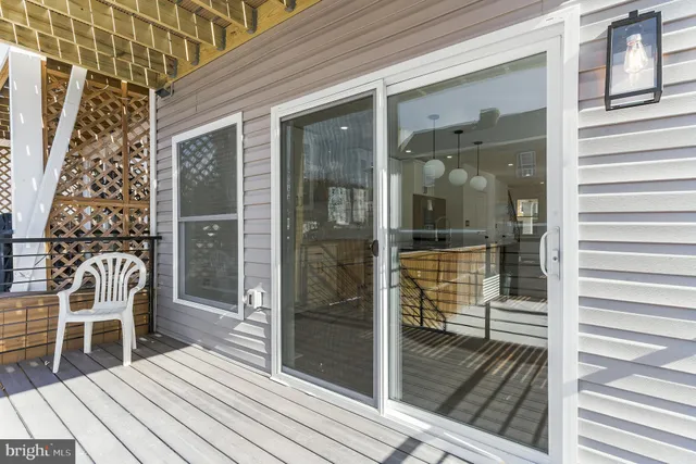 a view of a balcony with wooden floor