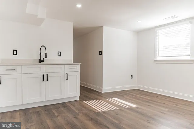 a view of cabinets with wooden floor