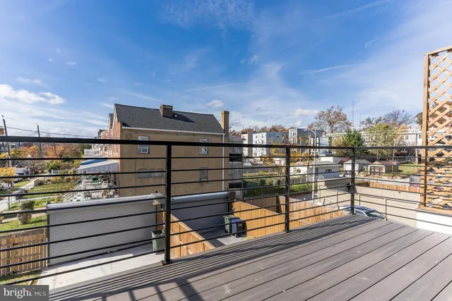 a view of a balcony with wooden floor