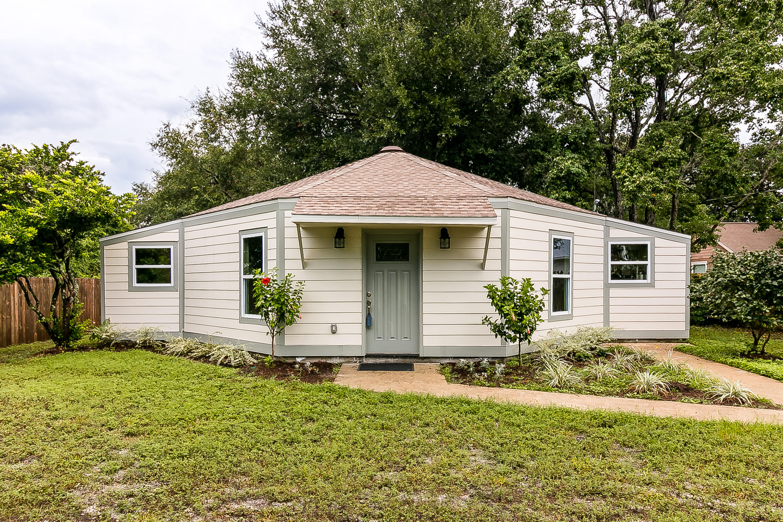 a front view of house with yard and green space