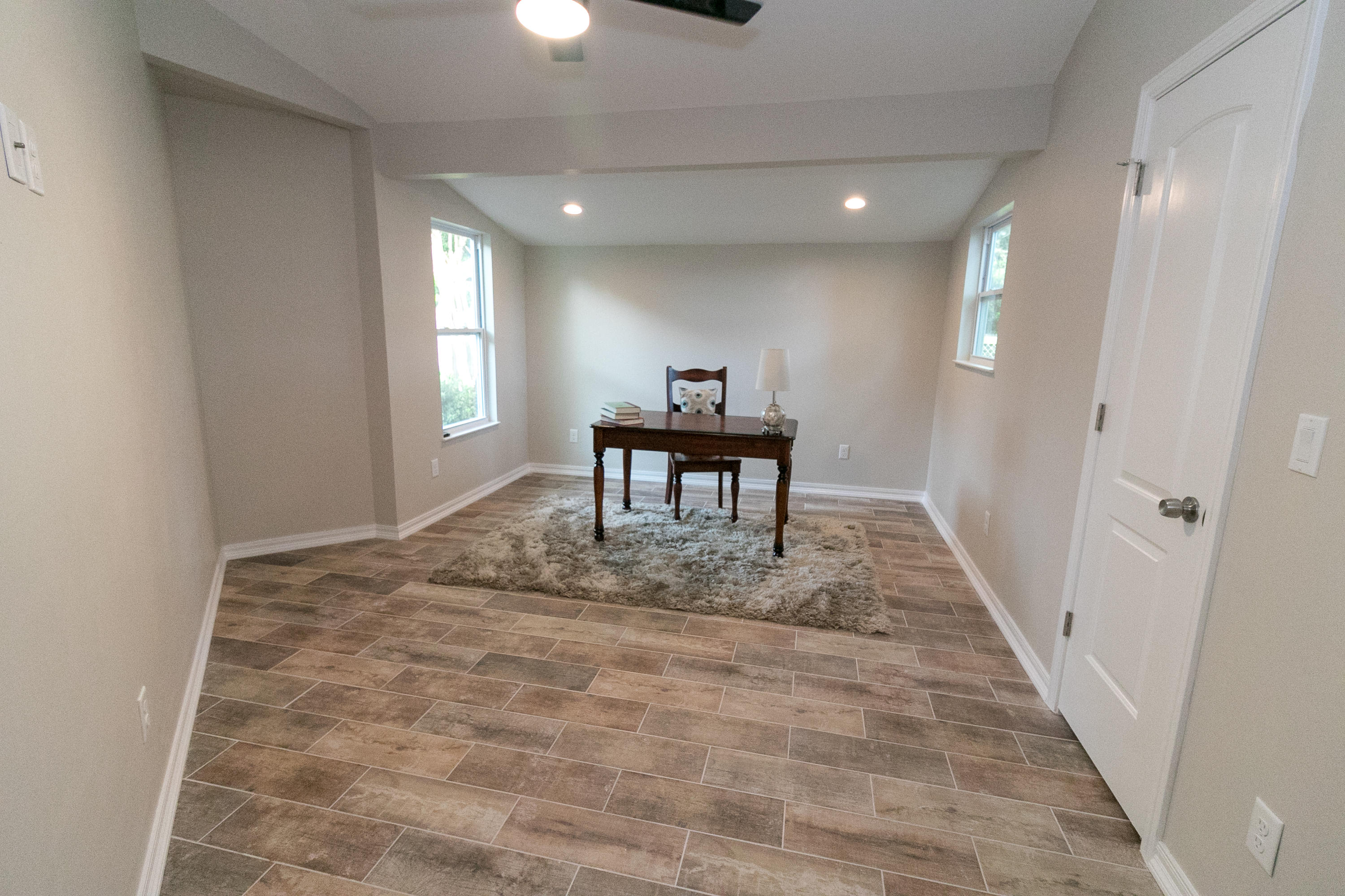 502 3rd Avenue Destin, FL 32541 - Photo 11 of 18 a view of a hallway with two windows