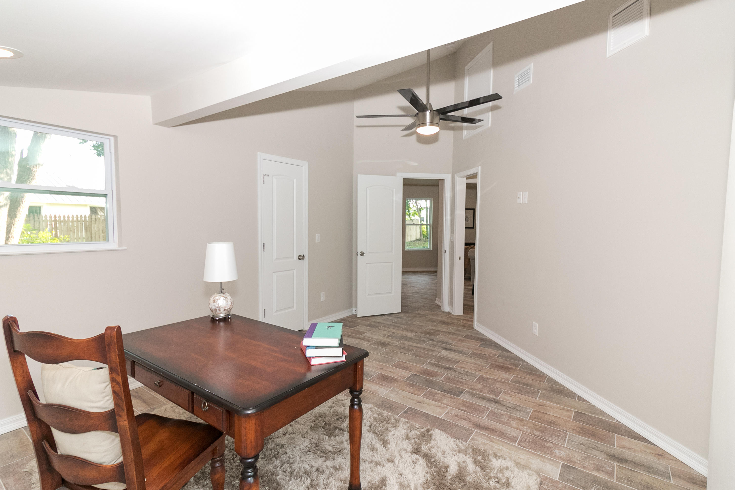 502 3rd Avenue Destin, FL 32541 - Photo 12 of 18 a view of a room with furniture and wooden floor