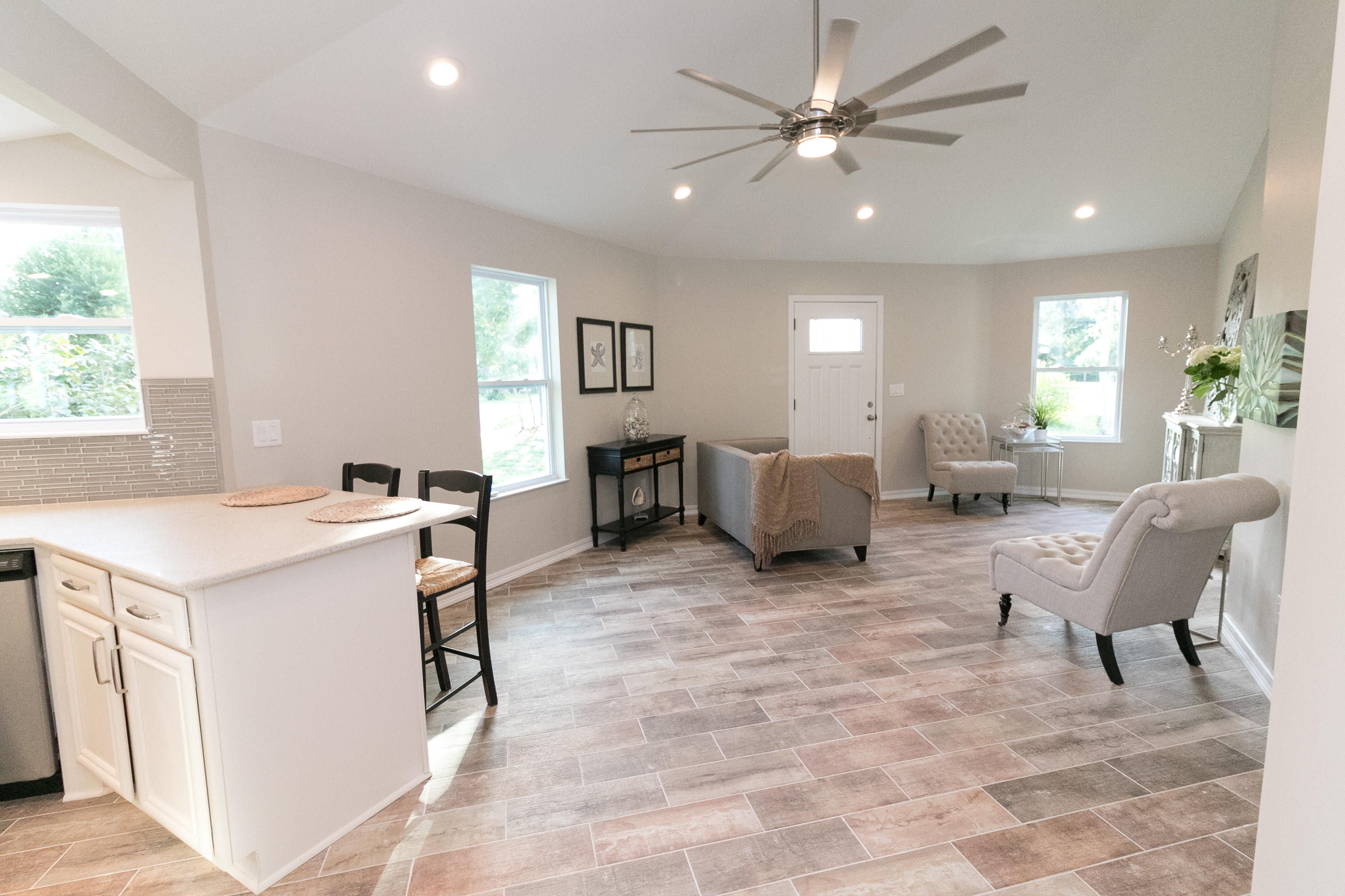 502 3rd Avenue Destin, FL 32541 - Photo 4 of 18 a living room with furniture a dining table and a window