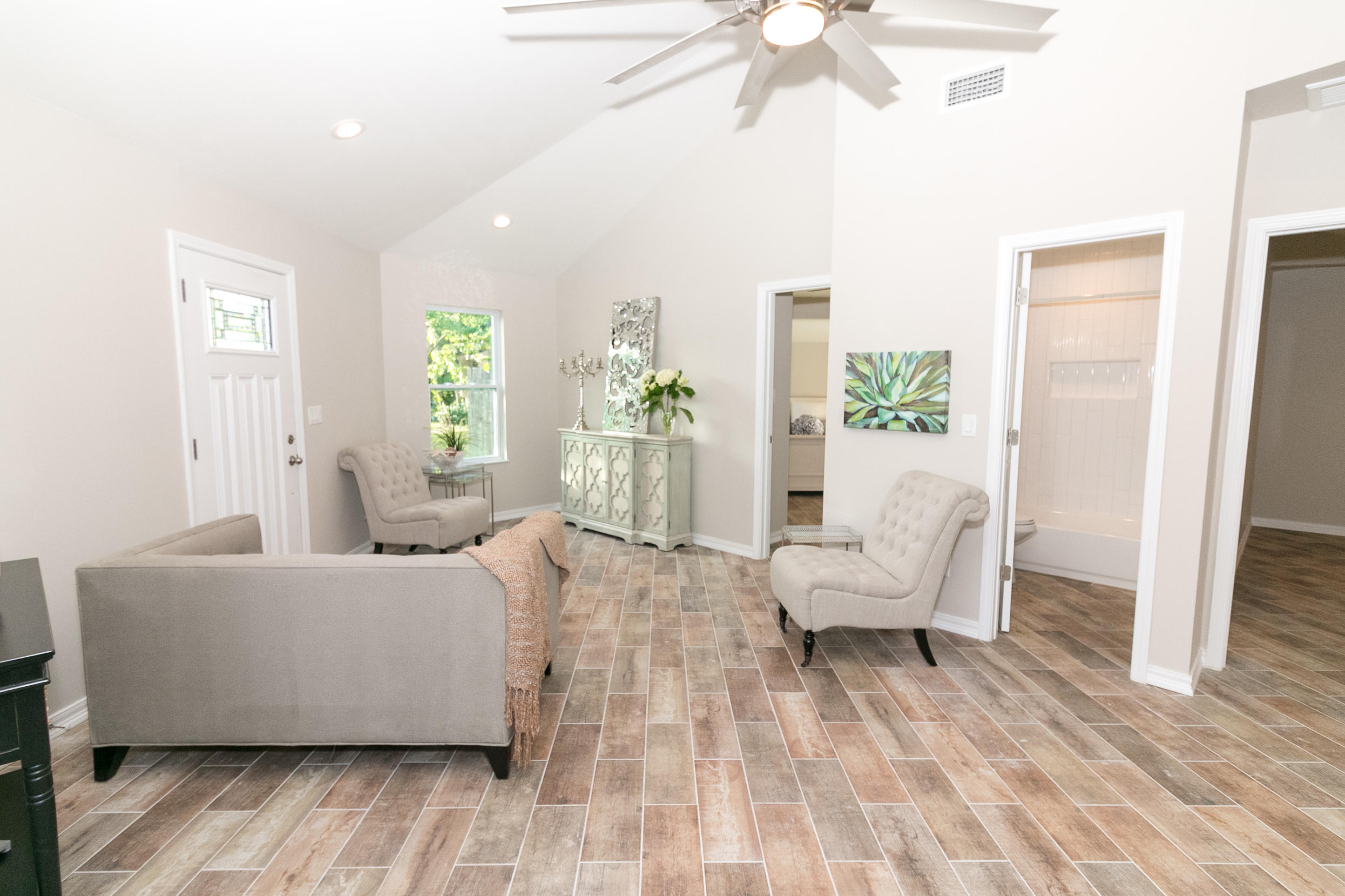 502 3rd Avenue Destin, FL 32541 - Photo 7 of 18 a living room with furniture and a chandelier