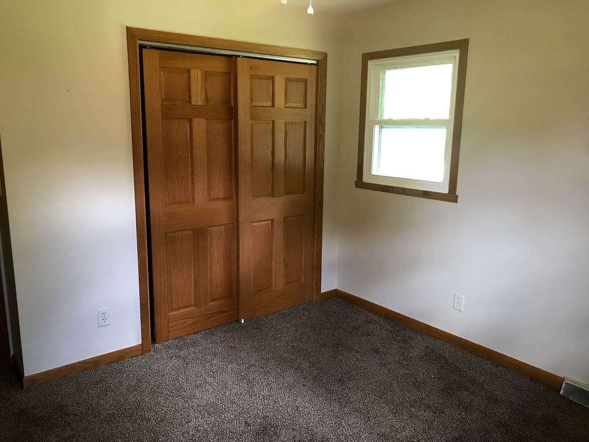 6617 Barkridge Road Roscoe, IL 61073 - Photo 13 of 19 an empty room with windows and closet