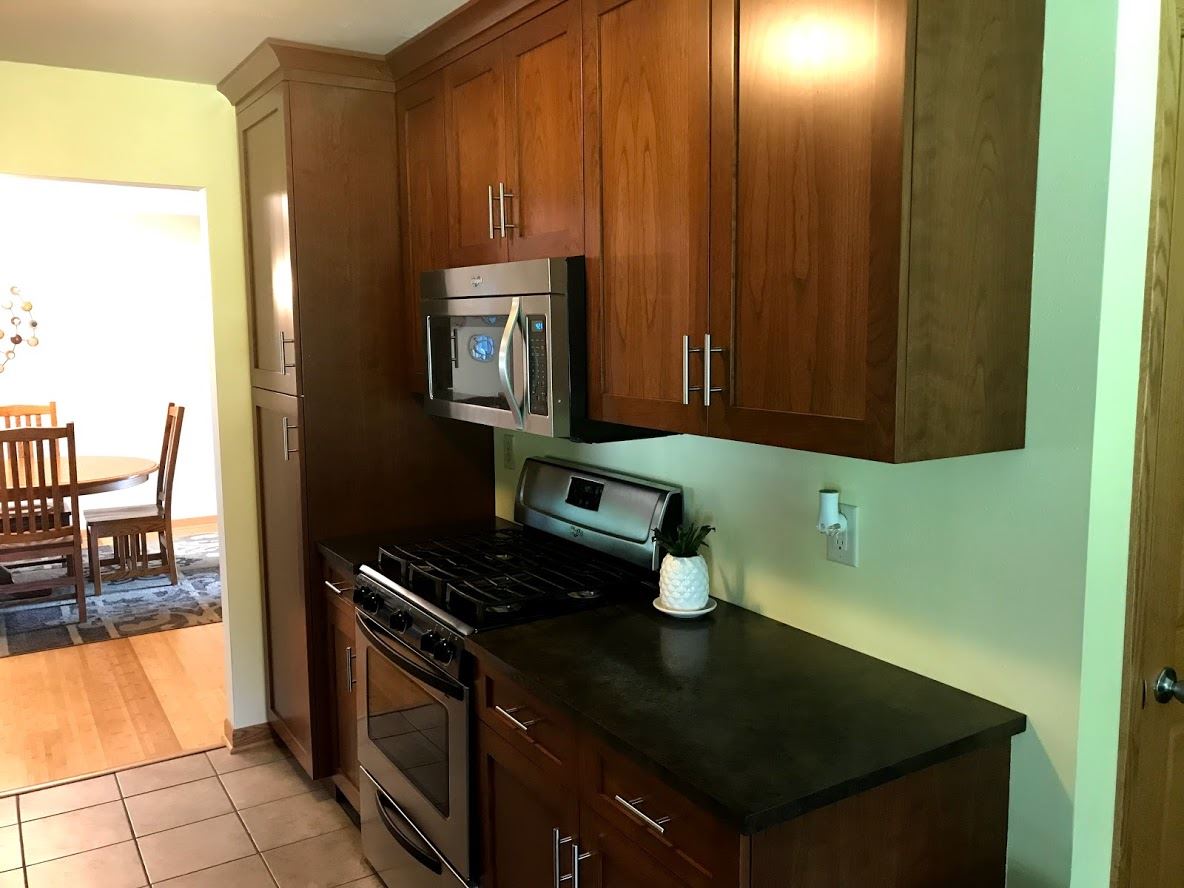 6617 Barkridge Road Roscoe, IL 61073 - Photo 6 of 19 a kitchen with a sink a stove and cabinets