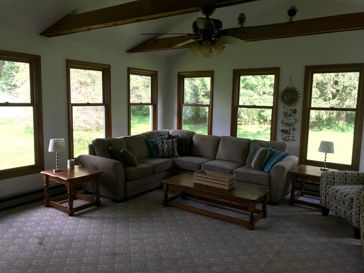6617 Barkridge Road Roscoe, IL 61073 - Photo 8 of 19 a living room with furniture and a large window