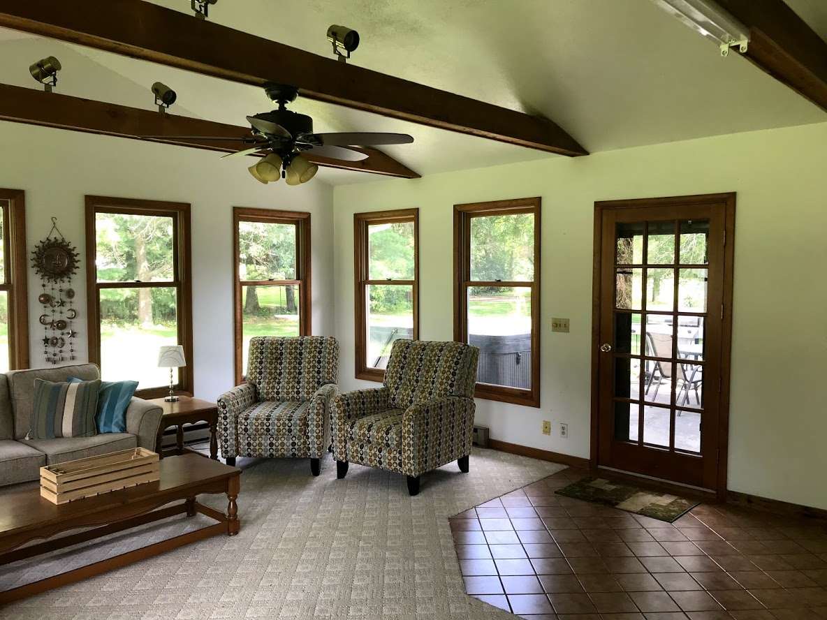 6617 Barkridge Road Roscoe, IL 61073 - Photo 9 of 19 a living room with furniture and a large window