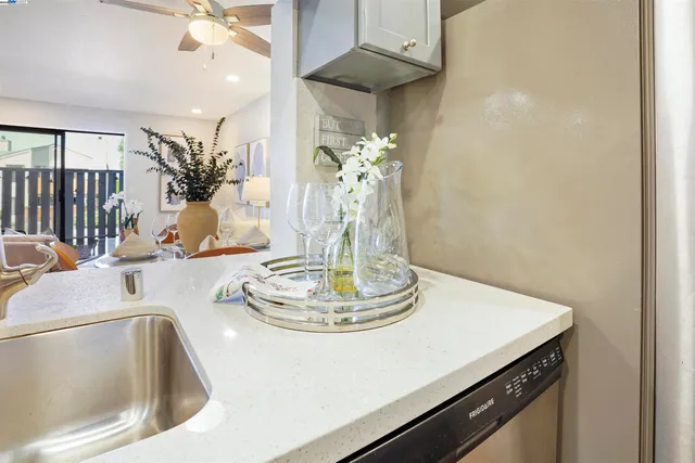 a dining table with wooden floor and a chandelier