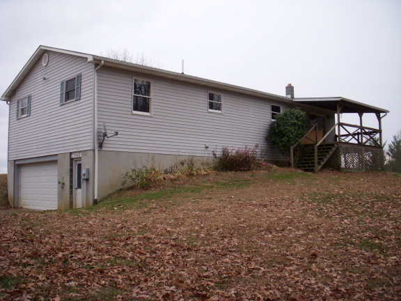 1554 Conner Grove Road Southwest Willis, VA 24380 - Photo 3 of 22 a view of a house with backyard and chairs