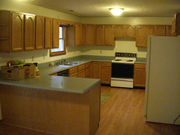 1554 Conner Grove Road Southwest Willis, VA 24380 - Photo 8 of 22 a kitchen with stainless steel appliances a sink a stove and a refrigerator