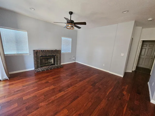 a bedroom with a bed and a potted plant