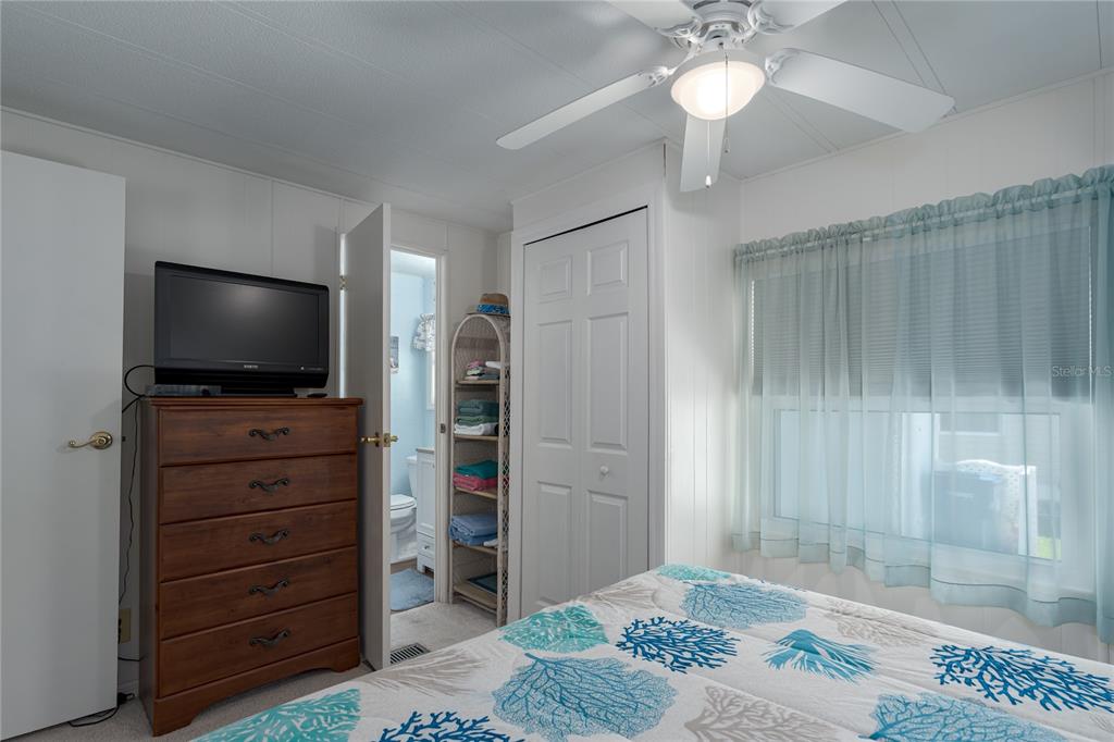 1416 41st Avenue East Ellenton, FL 34222 - Photo 11 of 26 a view of a livingroom with wooden floor cabinet and a flat screen tv