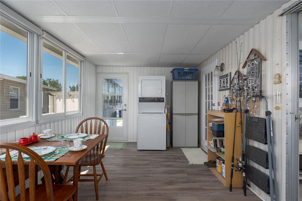 1416 41st Avenue East Ellenton, FL 34222 - Photo 16 of 26 a view of a dining room with furniture window and wooden floor