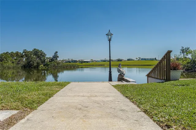 a view of a lake with a garden and lake view