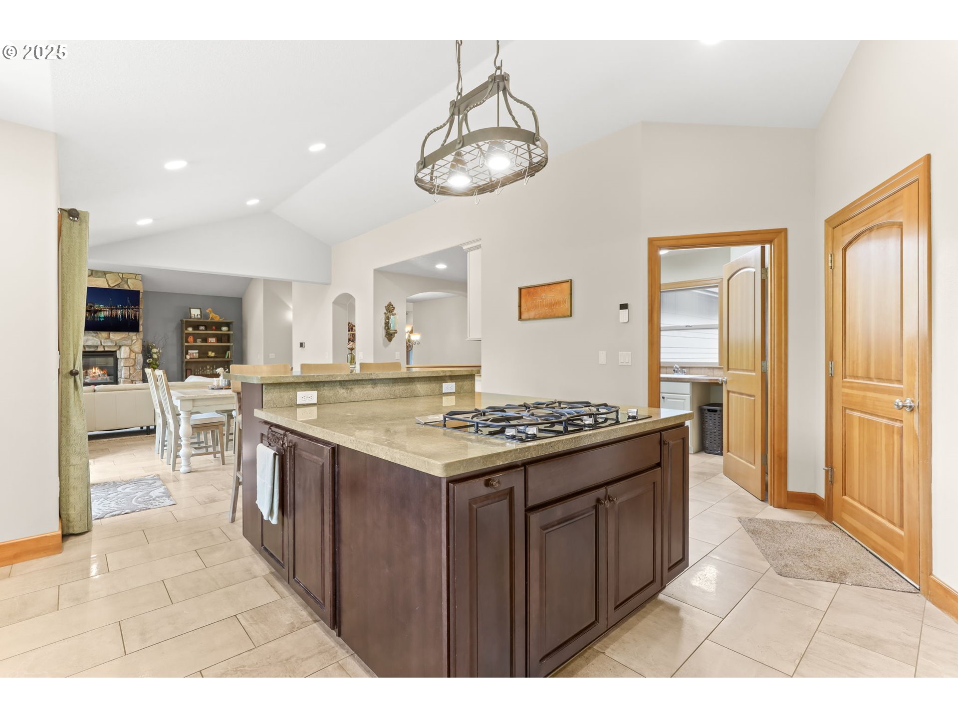8443 Southeast Orient Drive Gresham, OR 97080 - Photo 12 of 48 a kitchen with stainless steel appliances granite countertop a stove a refrigerator a sink dishwasher and a dining table with wooden floor