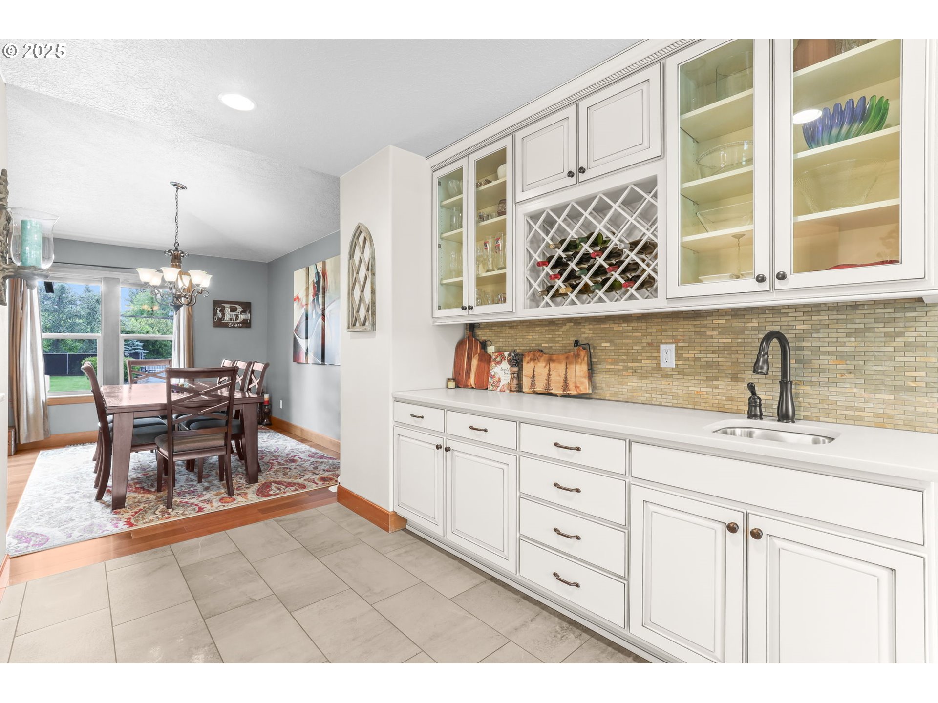 8443 Southeast Orient Drive Gresham, OR 97080 - Photo 13 of 48 a kitchen with a sink and wooden cabinets