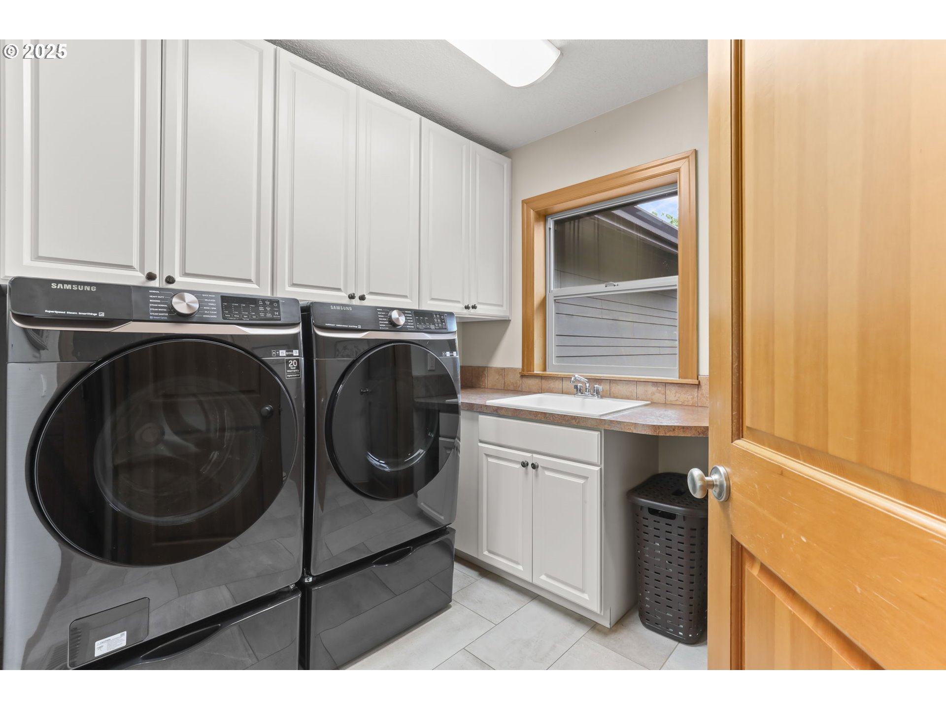 8443 Southeast Orient Drive Gresham, OR 97080 - Photo 16 of 48 a utility room with sink dryer and washer